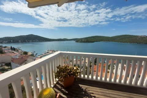 Real estate Tisno, Designer apartment with a large terrace and a panoramic view of the sea and Tisno